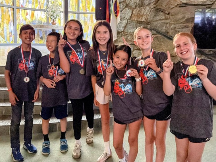 Odyssey of the Mind team with their competition medals